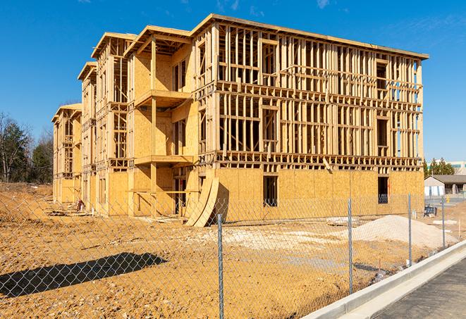 a job site enclosed by temporary chain link fences, ensuring safety for workers and pedestrians in Tarzana